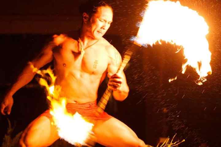 a person standing in front of a fire