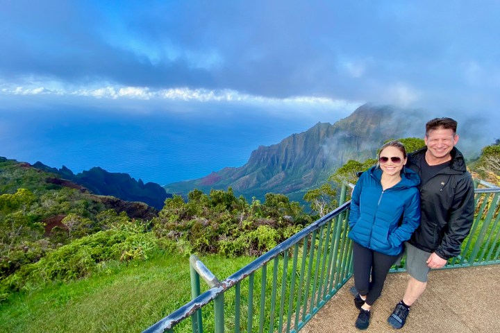 a person standing in front of a mountain