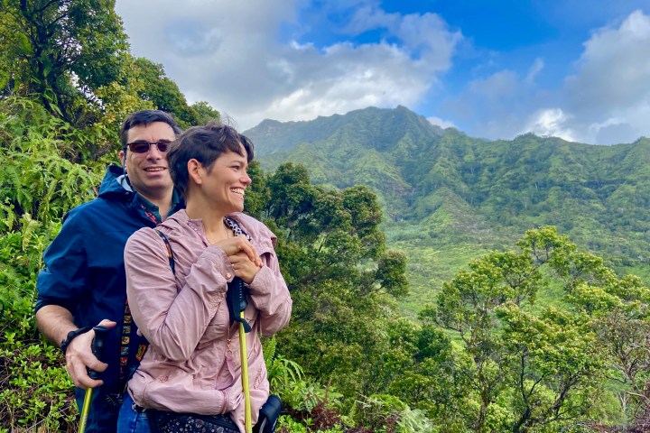 a person standing in front of a mountain