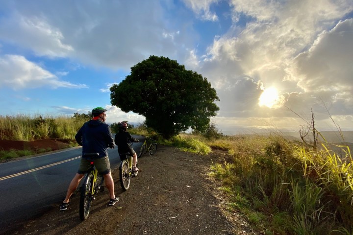 a person riding a skateboard down the side of a road