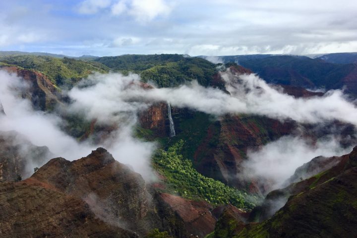a smoke on the side of a mountain