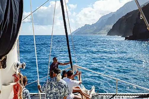 a group of people in a boat on a body of water