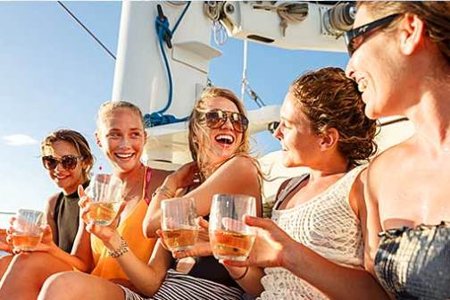 a group of people holding wine glasses