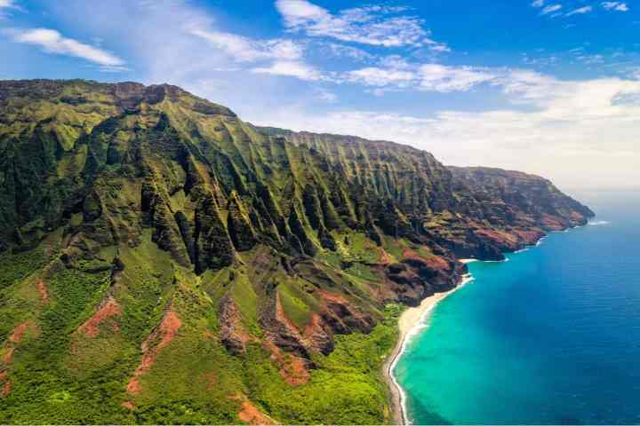a body of water with a mountain in the background