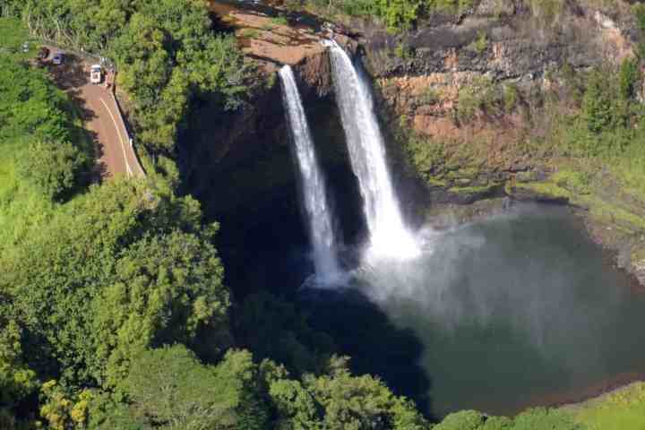 a large waterfall in a forest