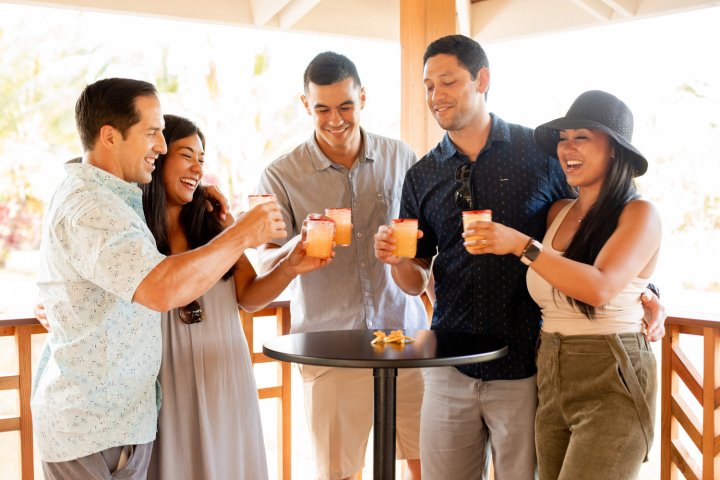 a group of people holding wine glasses