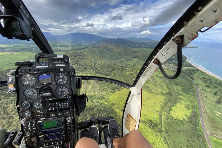 a person sitting on top of a mountain