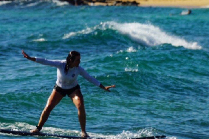 a person riding a surf board on a body of water