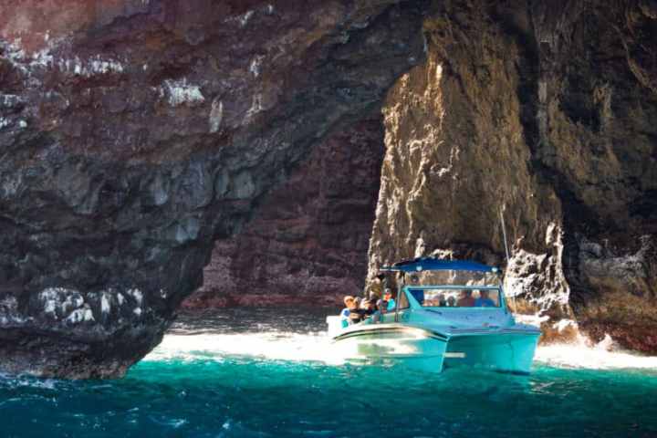 a body of water with a mountain in the background