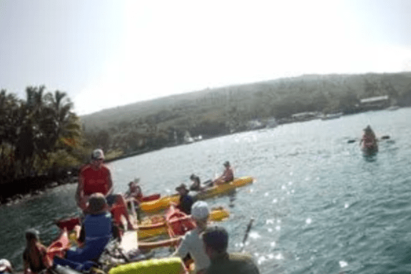 a group of people in a boat on a body of water