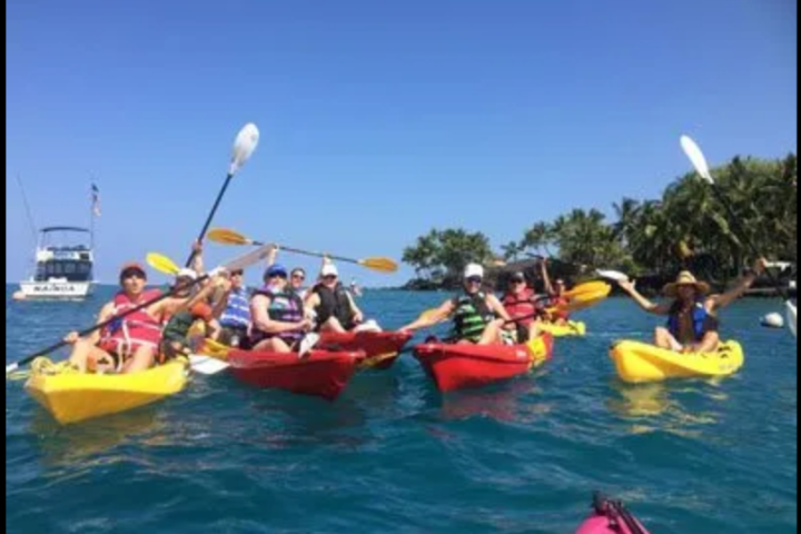 a group of people on a boat in the water