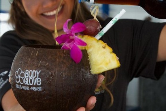 a woman holding a piece of cake