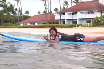 a little girl in a pool of water