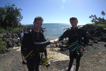 a man standing on a dirt road