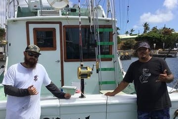 a man standing next to a boat