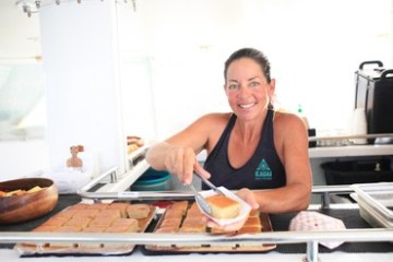 a woman preparing food in a kitchen