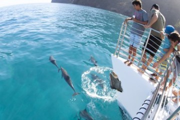a man riding a wave on a surfboard in the water