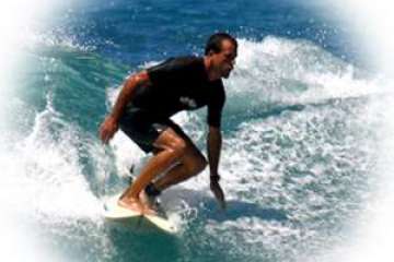 a man riding a wave on a surfboard in the ocean