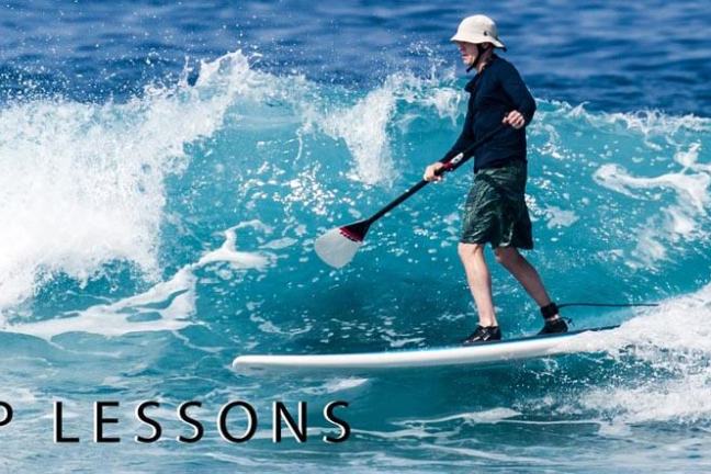 a man riding a wave on a surfboard in the water