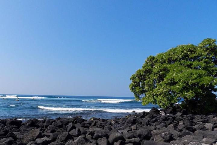 a rocky beach next to the ocean