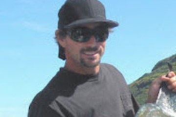 a man holding a fish