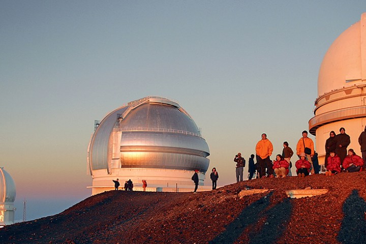 a group of people standing in front of a building