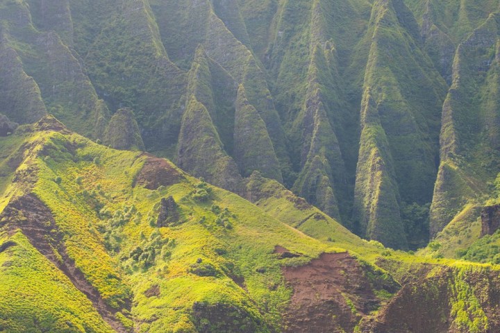 a body of water with a mountain in the background