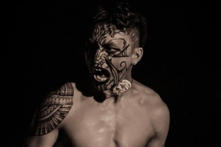 a couple of people that are standing in the dark