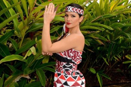 a person holding a plant in a garden