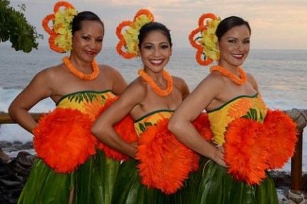 a group of people standing next to a body of water