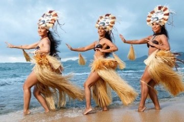 a woman standing next to a body of water