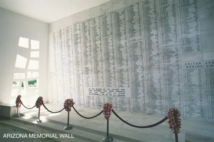 a room with white walls with USS Arizona Memorial in the background