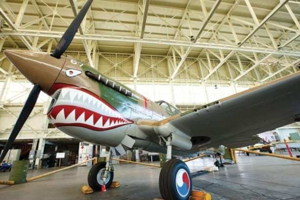 a large passenger jet sitting on top of a building