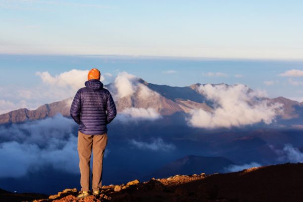 a man standing on top of a mountain