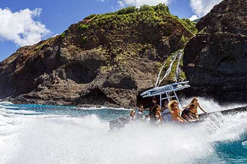 a body of water with a mountain in the background