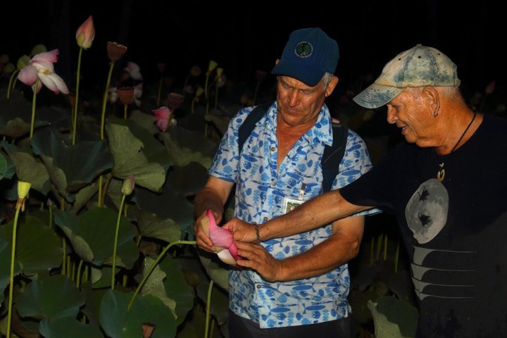 a man cutting a cake
