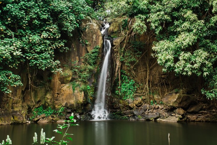 a large waterfall over a river