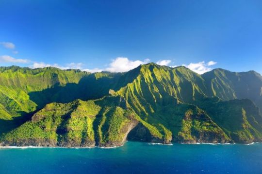 a body of water with a mountain in the background