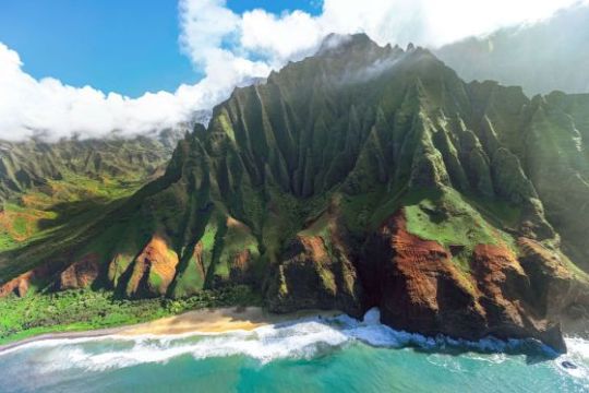 a body of water with a mountain in the background
