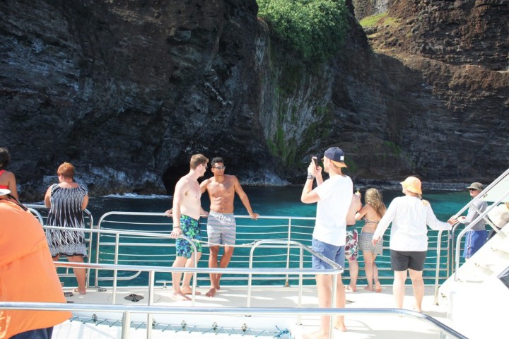 a group of people standing on top of a mountain