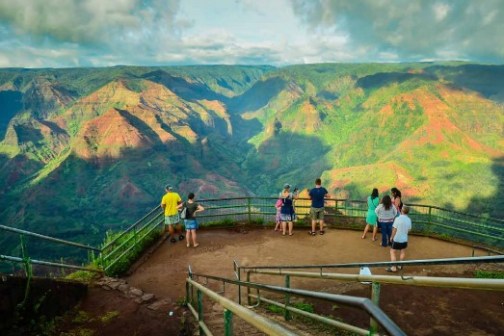 a group of people standing on top of a mountain