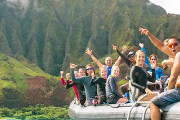 a group of people riding on top of a mountain