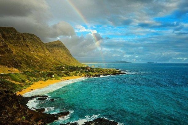a body of water with a mountain in the background
