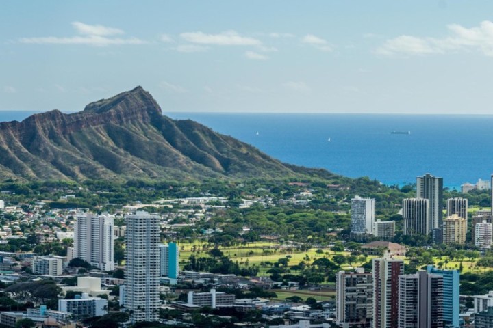 a large body of water with a city in the background