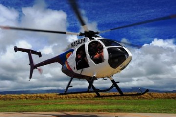 a helicopter landing on a runway