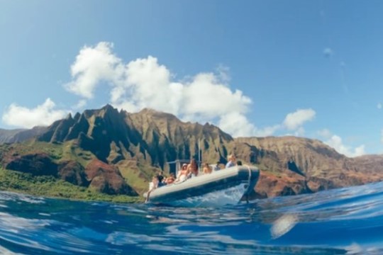 a body of water with a mountain in the background