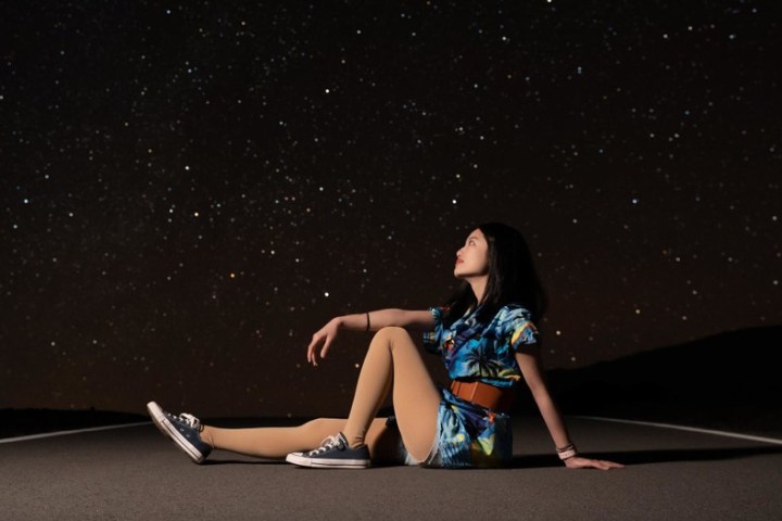 a woman sitting at night