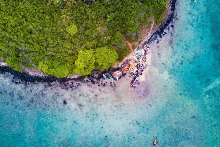 a person riding a wave on a surfboard in the water