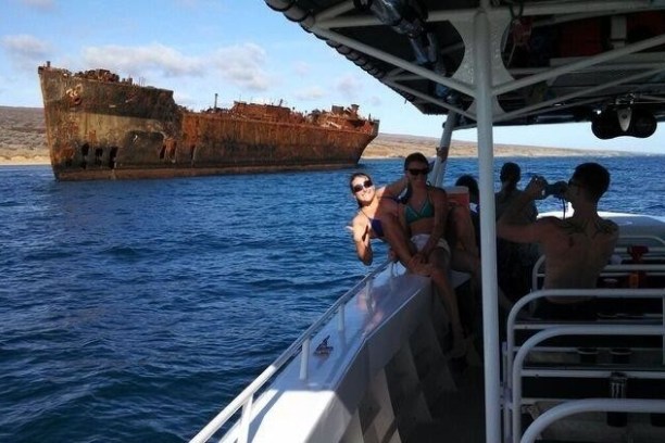 a group of people on a boat in the water