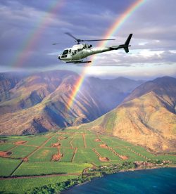 air maui WEST-MAUI-MOLOKAI-SPECIAL-927×1024 Helicopter flying over mountains with a double rainbow and fields below.
